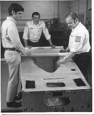 Don Cox, Earl McMullen and Karl Kainhofer at the Penske Racing shop.