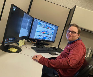 Team Penske graphic designer Jordan Erickson hard at work.