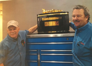 As one of Team Penske’s first NASCAR employees, David Little (right) has celebrated the team’s success over the years.