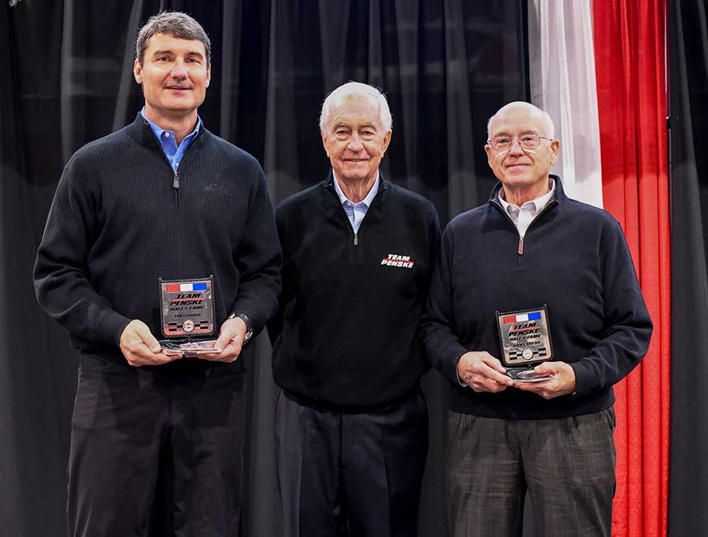 As the members of the 2021 class, Tim Cindric (left) and Jerry Breon are presented with their Team Penske Hall of Fame awards by Roger Penske.