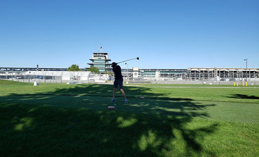 No. 22 INDYCAR team race engineer Ben Bretzman tees off at the Indianapolis Motor Speedway’s Brickyard Crossing.