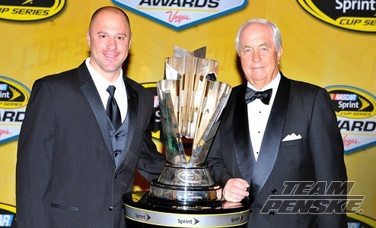 Chris Yoder celebrates the 2012 Championship with Roger Penske